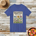 Blue "Plant Posse" wanted poster V-neck t-shirt on a wood plank floor surrounded by plants and a hat.